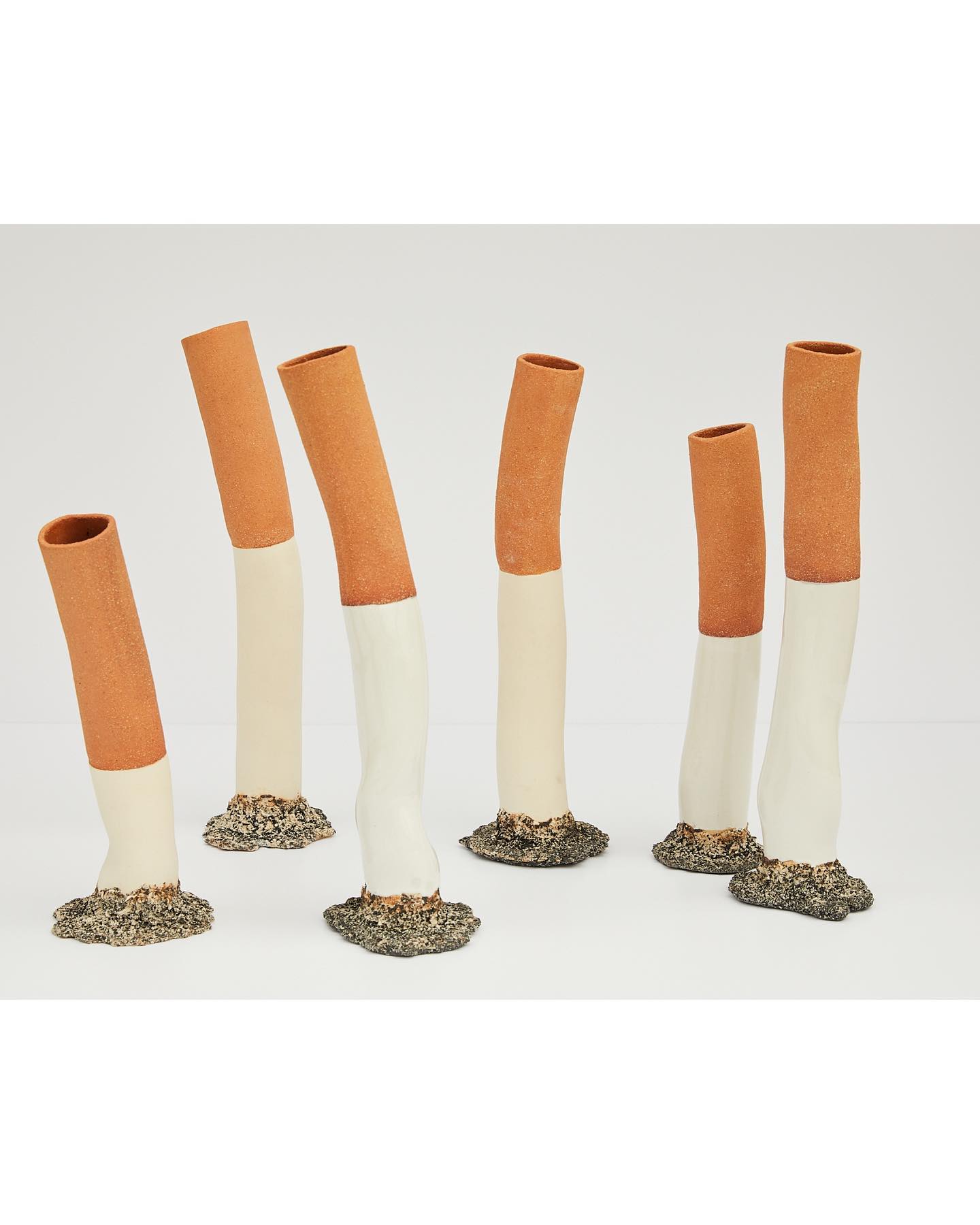 Unglazed cigarette vases